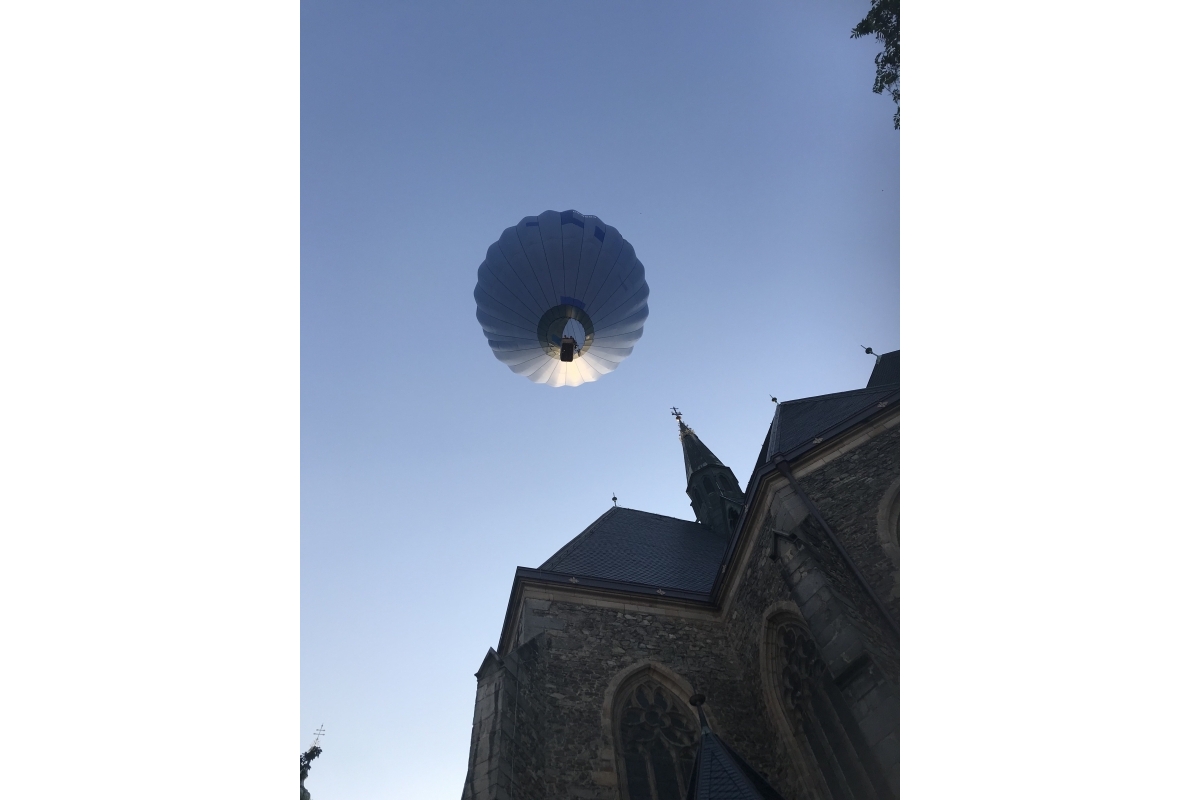 Young Photographer 2019/20 - The modern air balloon looked out of place next to the ancient building - Up and Away