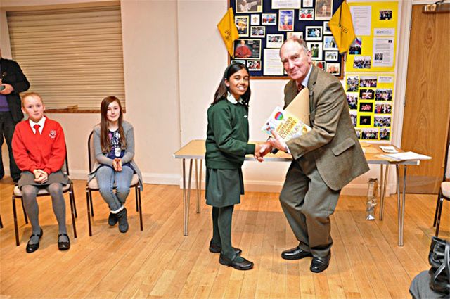 27 January 2011 - Christmas Story Competition winners receive their prizes - Ela Tandon of Heatherton House receives her prize from Terry Cann, President of Great Missenden Rotary Club. Ela was 3rd in the Year 6 category.