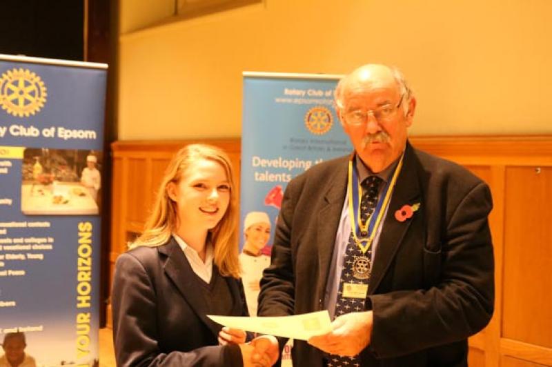Young Musician Epsom Rotary Heat - Emma Hibbit gets her certificate from Clive