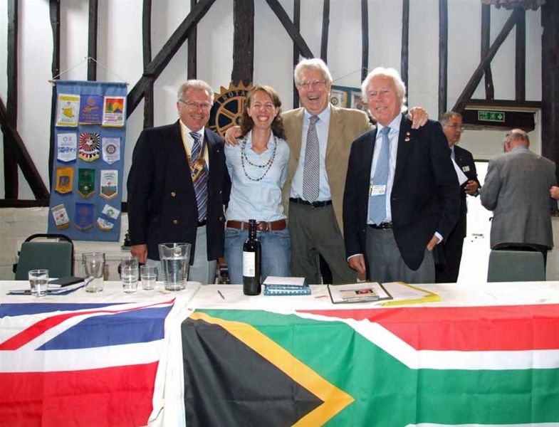31 August 2011 - Ambassadorial Scholar Lindi bids us farewell - Behind the flags of the UK and South Africa - from left to right, Club President George Boyle, Lindi van Niekerk, Dieter Shaw and Chalmers Cursley.