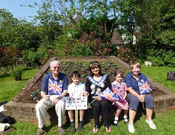 25-31 May 2012 - The 4 winning flowerbed designs are planted - Boot and Slipper flowerbed - the finished bed with Rotarian Dave Bevan, Vincent, Mayor Mimi Harker, Ava and Rotarian Pat Armstrong.