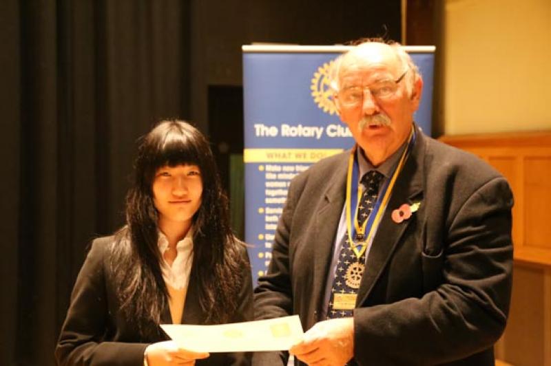 Young Musician Epsom Rotary Heat - Fumie Shi receives a competing Certificate from Clive