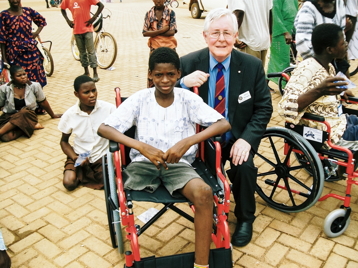 International Service - A Tamale wheelchair recipient with Rtn Stephen Harrington.