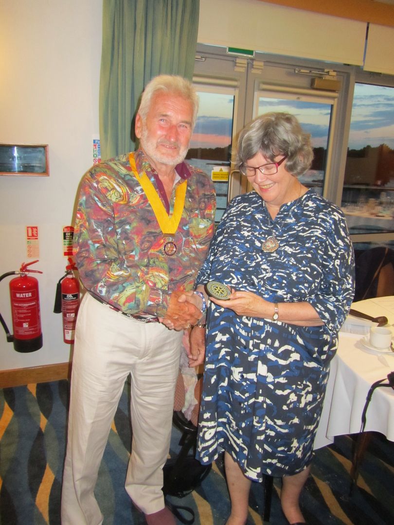 Fifth Monday Dinner - Keith presents Clare with a Club Rotary coaster