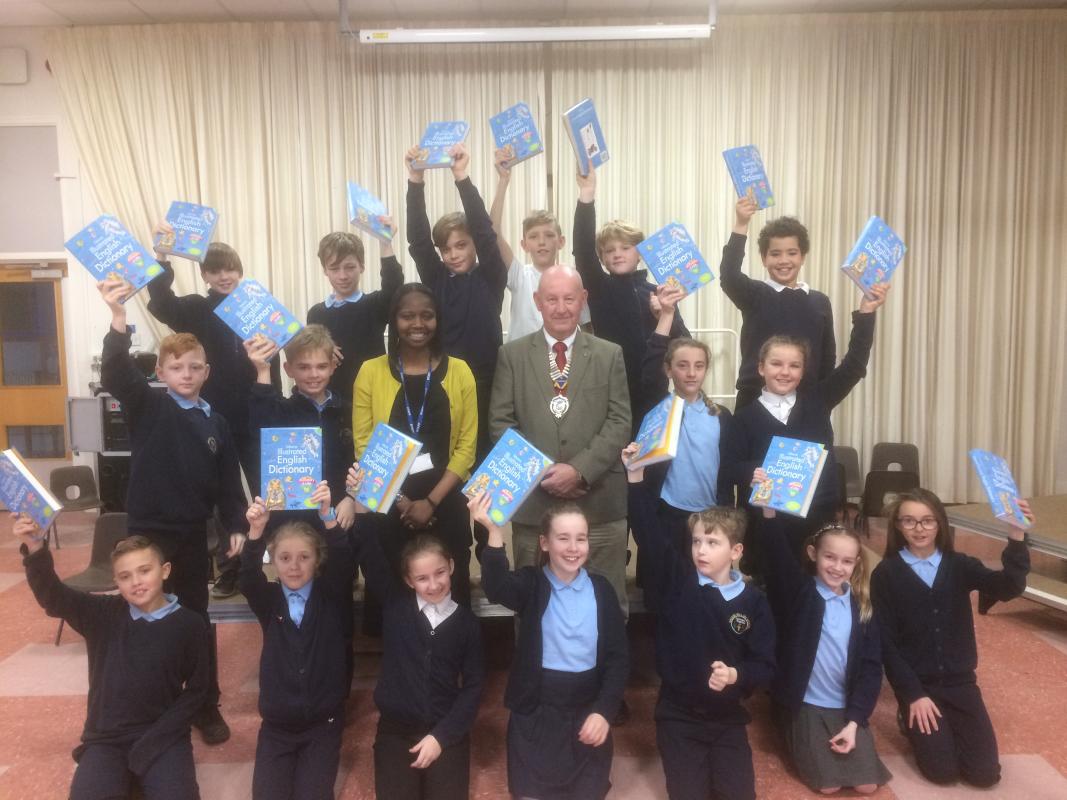 DICTIONARIES 4 LIFE - with Head Maxine Barker and Dick Wood, President of the Wakefield Chantry Rotary Club, who presented the books to the pupils at their assembly. 