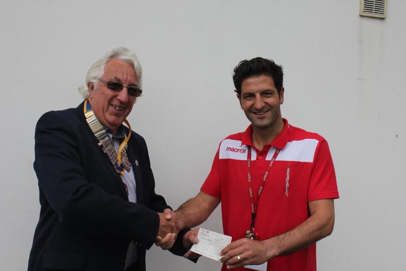 Rotary Sponsor Schools 20-20 Cricket - President Ian presenting a cheque to Andy Harris, PE teacher at Brannel