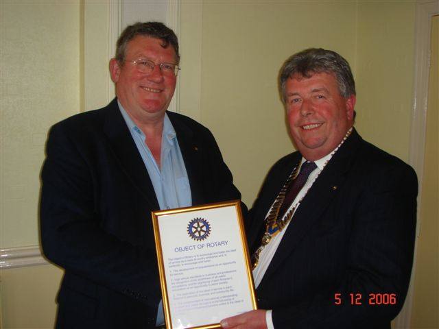 Induction of New Members - President Robert with new Rotarian Bill Kirby