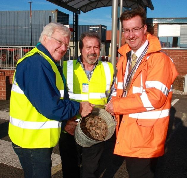 Oct 2012 -  RIBI President John Minhinick visits Greenock - Andrew Hemphill, Clydeport Ocean Terminal Operations Manager handed over the contents of the Wishing Bell to John and Alex.