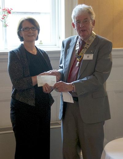 2012 Greenock Rotary Disbursements  - President Mike Kimpton presents a cheque to Karen MacLean who is a project worker for the Inverclyde Branch of Children 1st which operates an Abuse and Trauma recovery service.