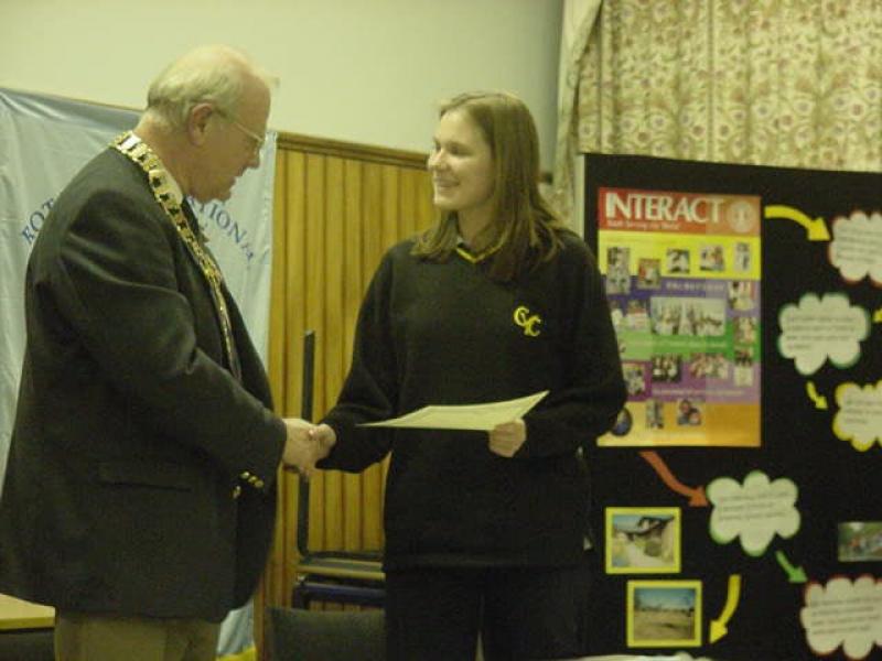 Feb 2012 Comberton Village College Interact Club - District Governor Tony Nash Rotary Club of Cromer and Sheringham, North Norfolk presenting the Charter Certificate to Ishbel Hughes.