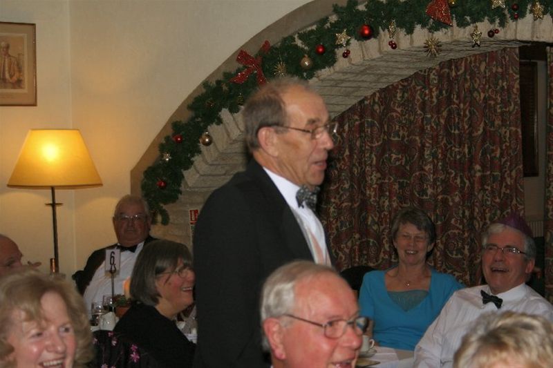 Chrismas Dinner 2010 - Mike Shillitoe hears he has been awarded a Paul Harris Award.