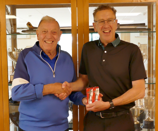 Occasional golfer Bob defies the odds to win the Paul Wellman Trophy - Event organiser, Dave Jarvis, presents Bruce Broadbent with the prize for Nearest the Pin.