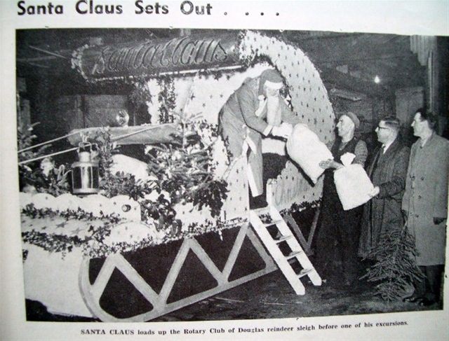 Vintage Pictures of Rotary Events - SANTA CLAUS loads up the Rotary Club of Douglas reindeer sleigh before one of his excursions. December 1938.