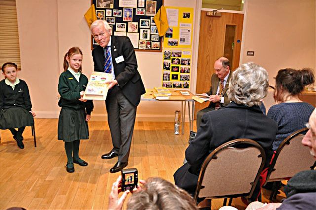 27 January 2011 - Christmas Story Competition winners receive their prizes - Olivia Fanning of Heatherton House receives her prize from Chalmers Cursley, President of Amersham Rotary Club. Olivia was 2nd in the Years 2 & 3 category.
