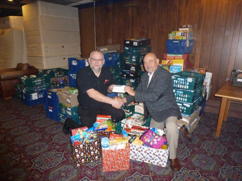 Xmas Hamper Appeal - President Bob, presenting Kevin Dobson, CAP Centre Manager, with a cheque for £500 towards the funds to buy the food necessary to pack a large quantity of hampers