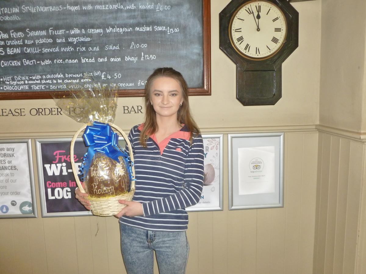 Easter Egg Raffle 2019 - The photo shows Carys displaying the winning Easter Egg