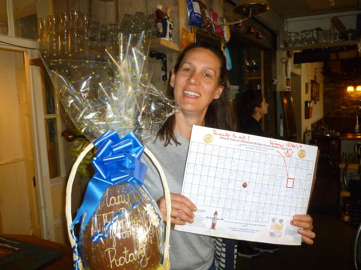 Easter Egg Raffle 2019 - The photo shows Jo licensee of the Rising Sun, Pensford drawing the winning number
