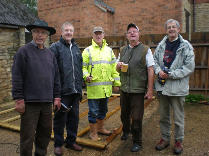 Oakfield's Homestead - Max, Malcolm, Roger, Chris and Alan pose in front of the base of the new pergola and pretend they're not wet