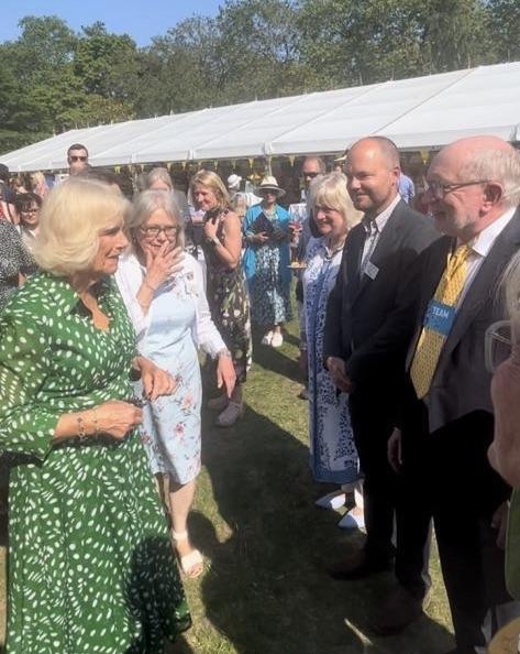 Club News 2022 - 2023 President Stav Melides - Member Paul Smith presented to Queen Camilla at a Garden Party at Marlborough House to mark the Thirtieth Anniversary of 'Bees for Development', for which she is a patron.