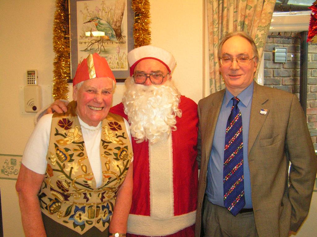 Christmas - Rotary Santa helps out at the Sandown Court residents Xmas party.