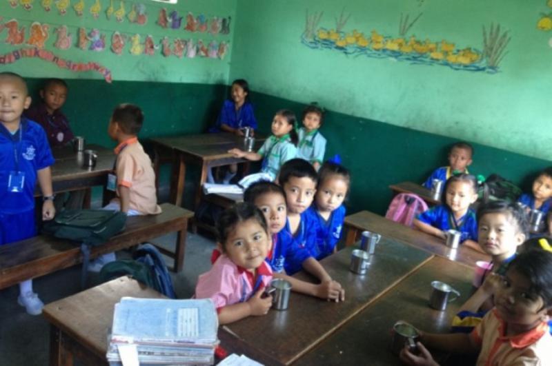 International Service - Nepalese children enjoying their daily mug of milk at the Pegasus School