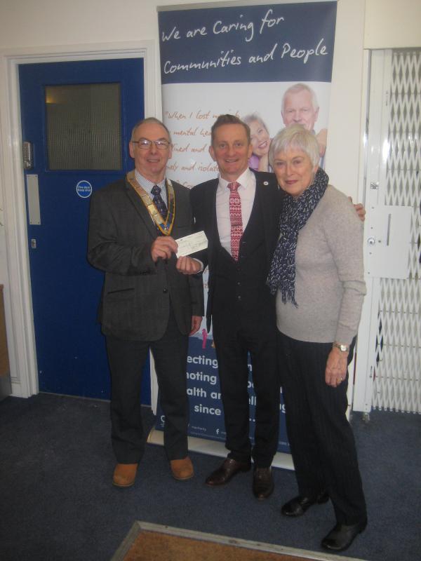 Christmas Collection 2018 - Simon and Penny presenting a cheque for £500 to Cordell Ray, CEO of CCP, as a contribution towards its Hamper Scamper 2018
