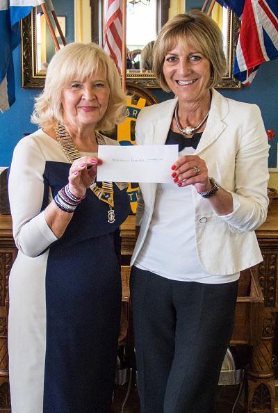 Happy Smiles on Disbursement Day - Mary Millar receives the cheque on behalf of Meningitis Research Foundation