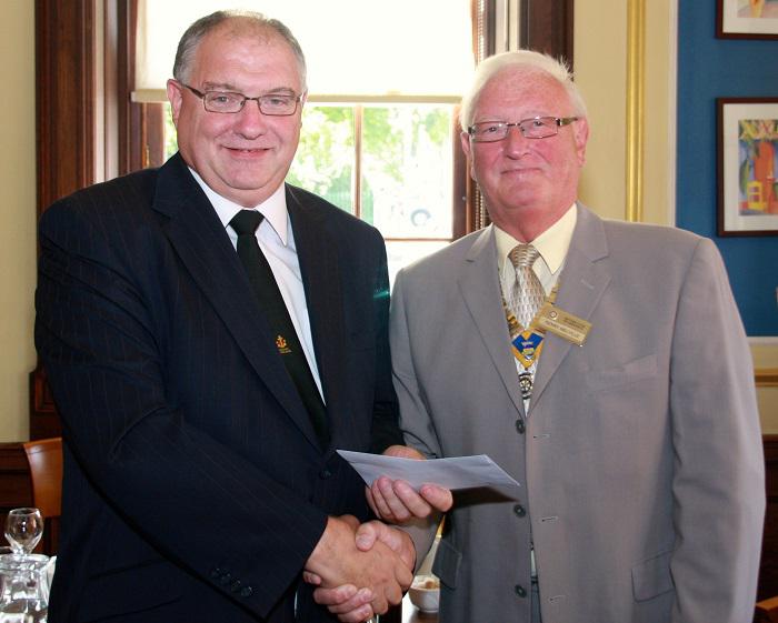 2013 Greenock RC Disbursement Day  - David Burnie receives a cheque from President Ken Melville for the Steadfast Silver Band.