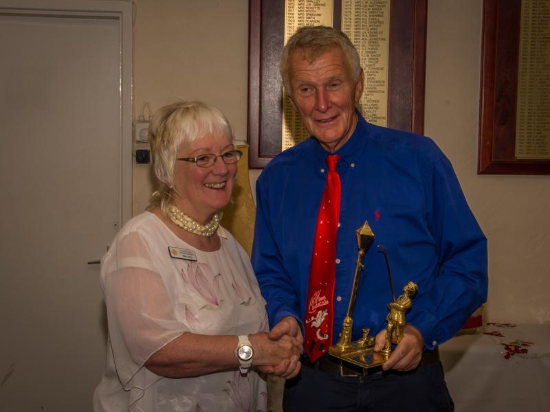 Members' Christmas Party - Mary receives the lamplighter for organising the Carol Service.