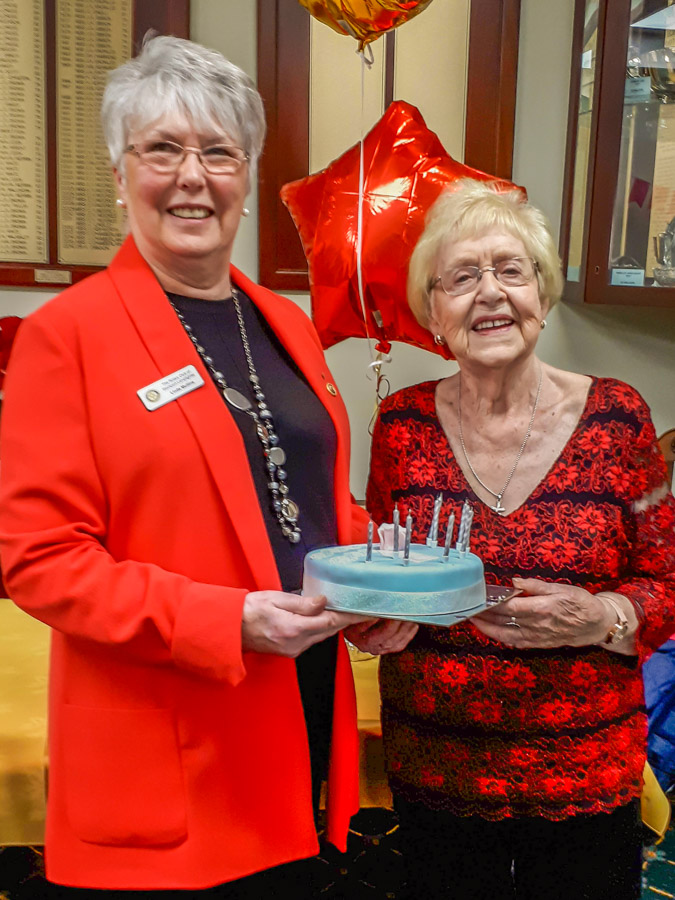 Joan's 90th Birthday - Linda presents the birthday cake.