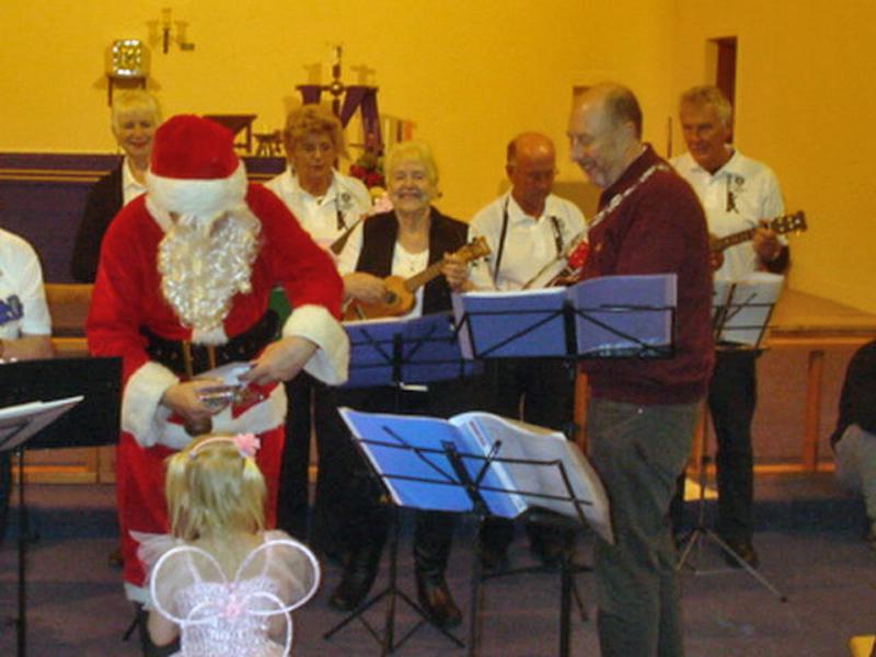 St Thomas Christmas Party - Santa and the band.