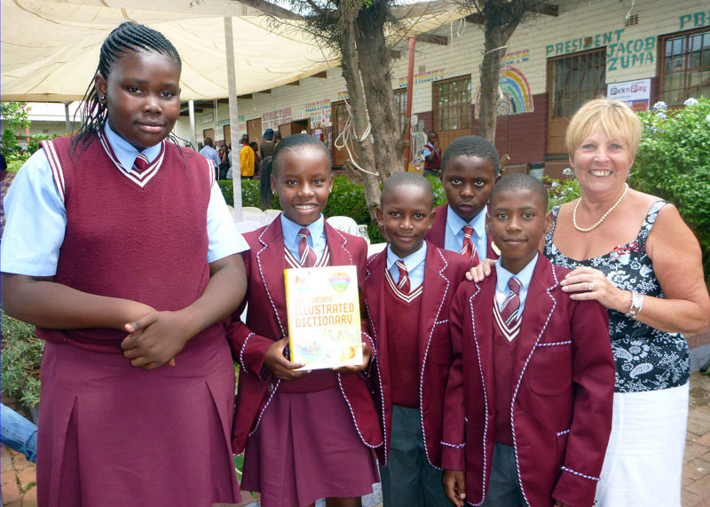 2012 Khensani Primary School - Carol presents Dictionaries for Life to children at the school.