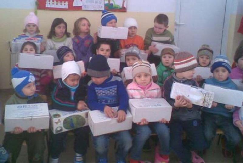 2013 Rotary Shoeboxes delivered in Romania - Please hurry up and take the photo so that I can open the box.