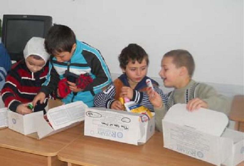 2013 Rotary Shoeboxes delivered in Romania - The excitement is obvious on the little faces as they delve into their shoebox