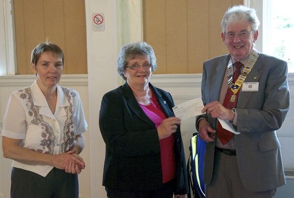 2012 Greenock Rotary Disbursements  - President Mike Kimpton presents a cheque to Margaret Stewart and Rose Mary Bowes for Alzheimer's Scotland Action on Dementia
