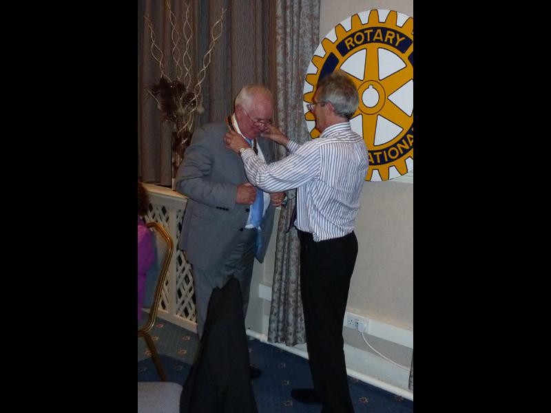 Handover Meeting - Outgoing President, John Doyle, hand over his badge to new President Bill Thomas