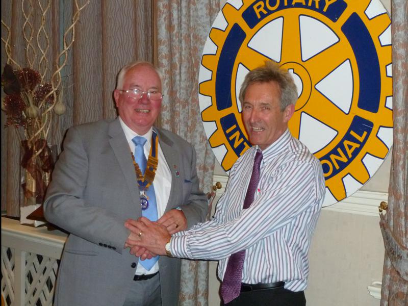 Handover Meeting - Outgoing President, John Doyle, hand over his badge to new President Bill Thomas