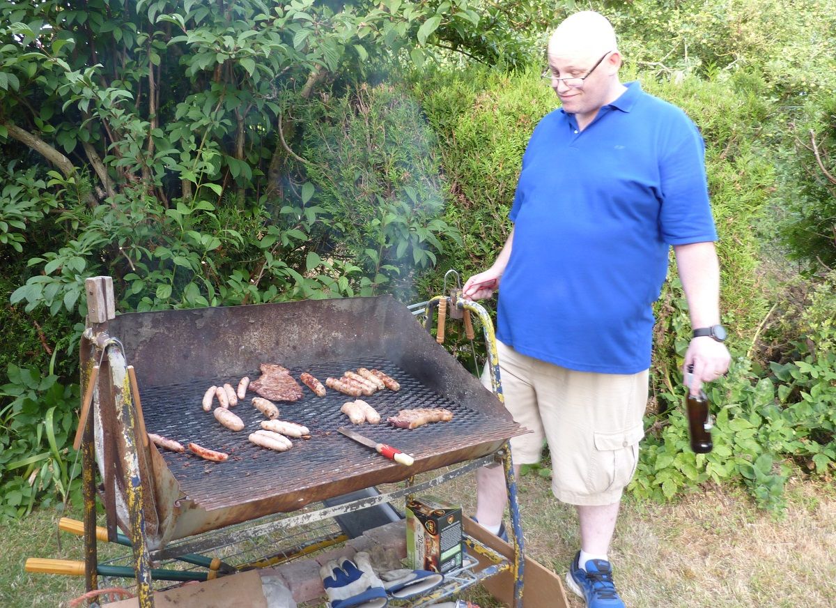 July 2022  Annual HANDOVER Party - BYO BBQ Harlton - Terry keeps an eye on the cooking
