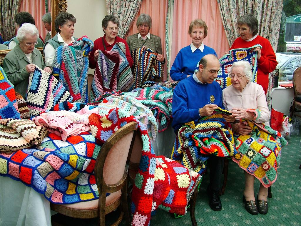 From Burbage WI - Blankets With Love - Rtn. Farouk Kardahji gets crochet lessons when he collects the 2nd batch!