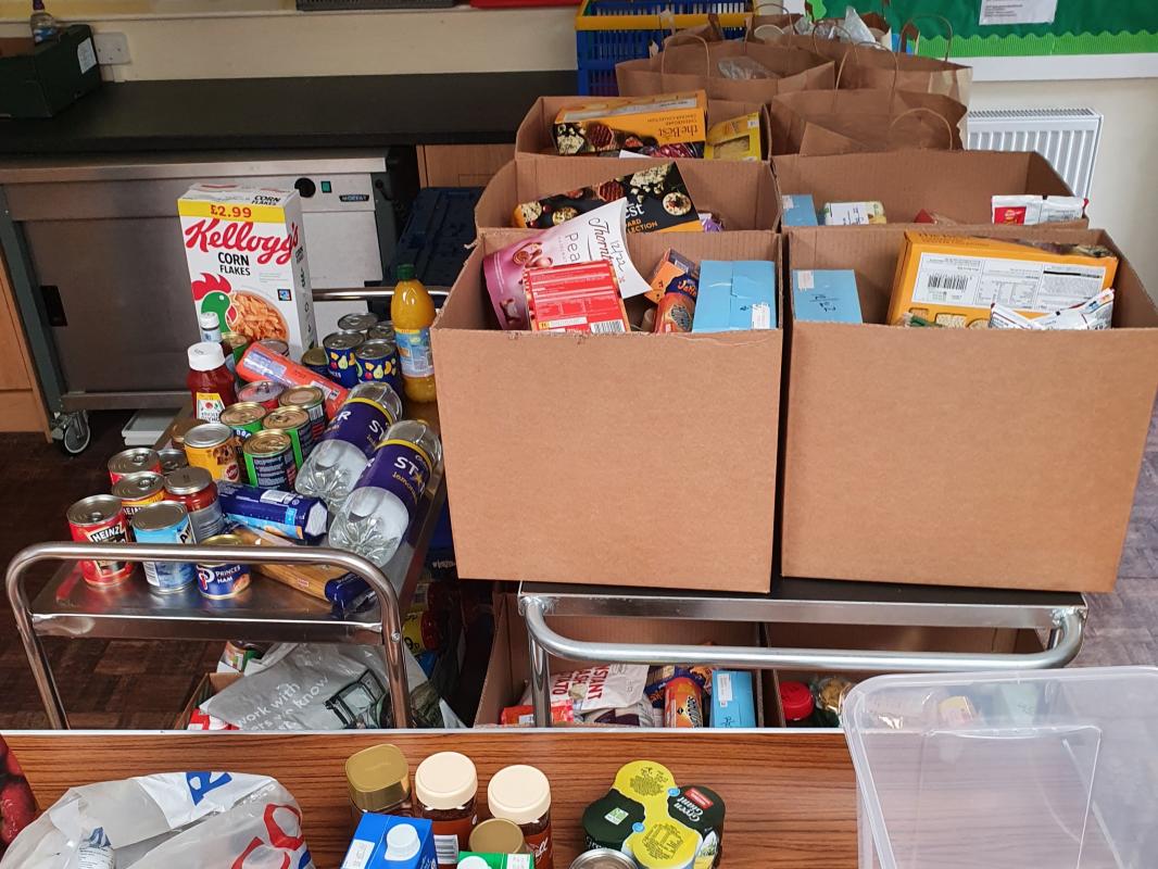 West Somerset Food Cupboard - Donations from the club being booked in.