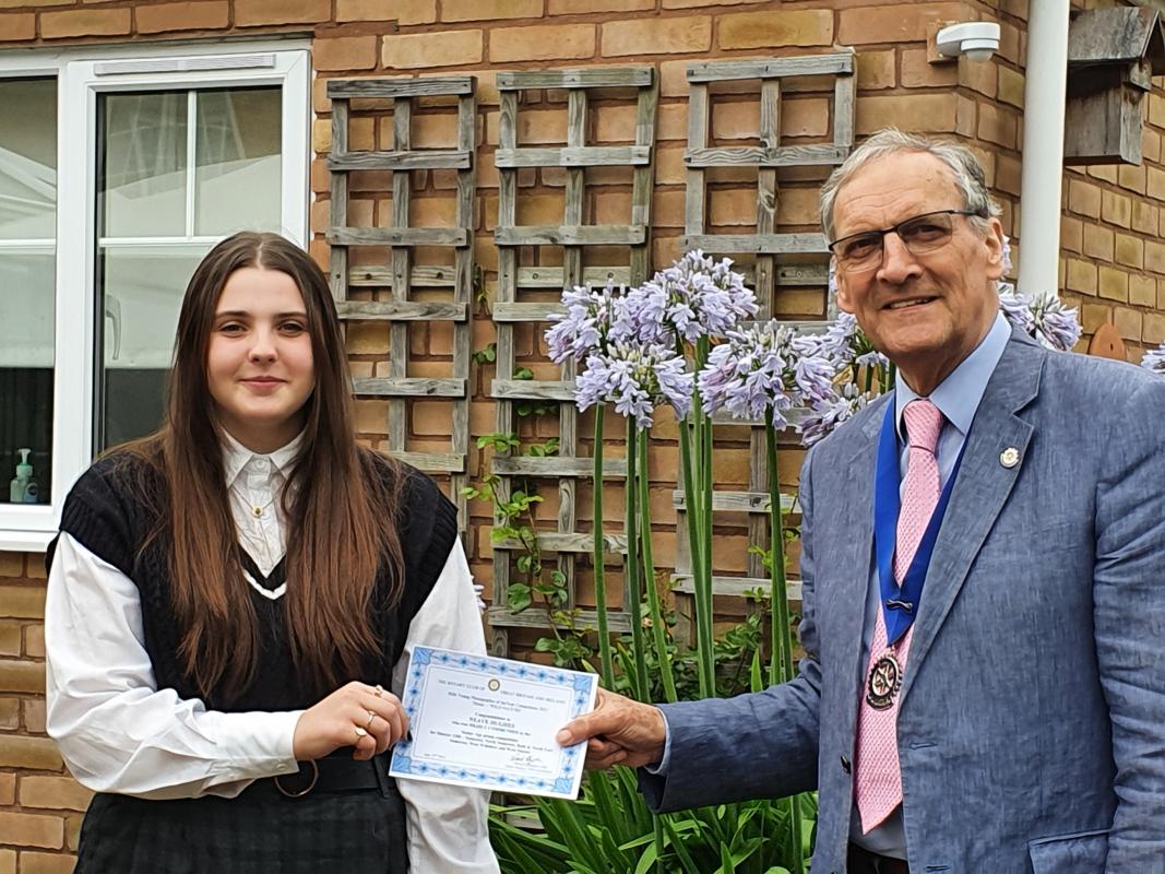 Young Photographer Winners announced - Neave receiving her certificate from President Peter Renshaw