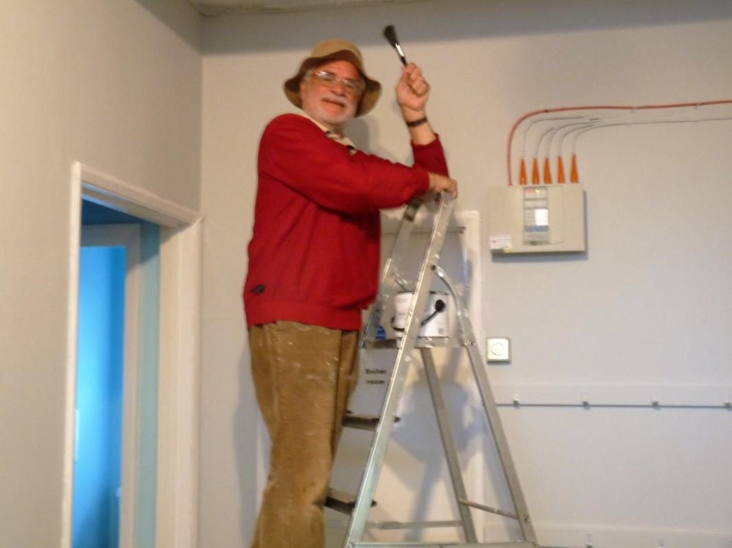 Decorating the Filey Youth Centre Cafe - Les celebrates a job well done with a final flourish of the paint brush