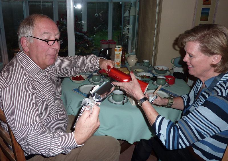 DEC 2013 Visitors from Enschede, Holland - Henk and Corrie getting the hang of Xmas Crackers Dec 2013.