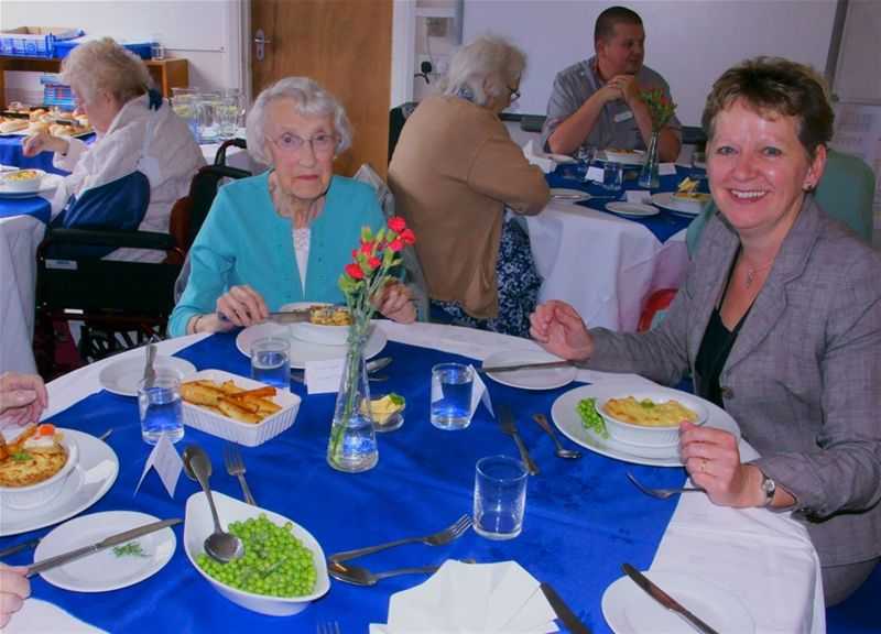 Senior Citizen's Lunch hosted by Maidenhill School - The Deputy Head with some guests enjoying lunch.
