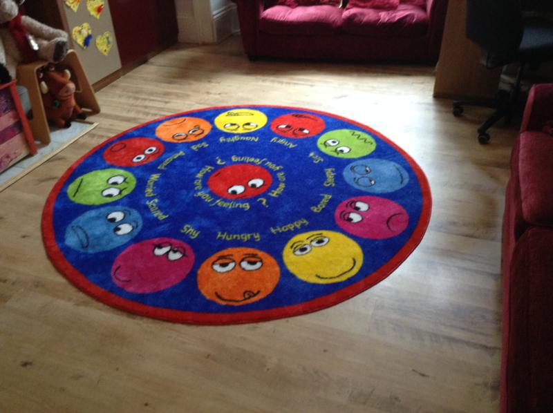 Trinity making a BREAK for it - The Emotions Rug used by the children to show how they are feeling