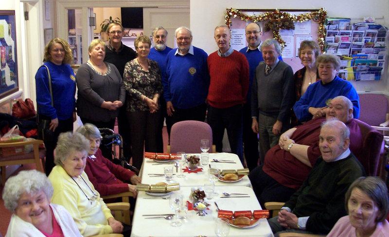 Rotary Year 2012-13 - Members of Dunbar Rotary Club help entertain diners at the Day Centre on Christmas Day.