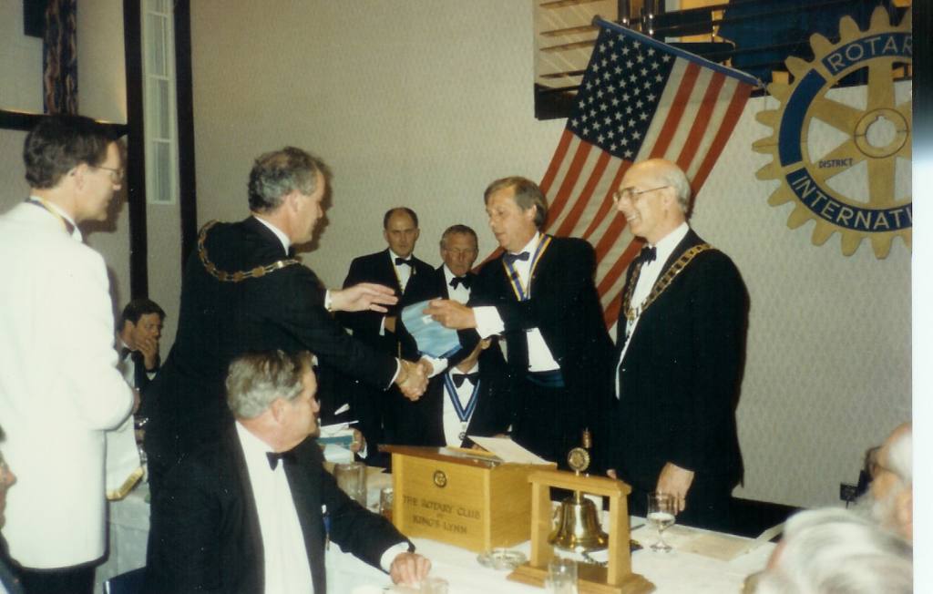 Charter Ceremony 1989 - Roger receives a banner from a visiting Rotary Club
