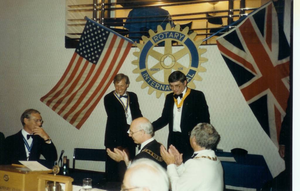 Charter Ceremony 1989 - Roger presents Senior Vice President Malcolm Wood with his insignia