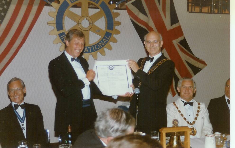 Charter Ceremony 1989 - President Roger receives the Club's Charter from the District Governor