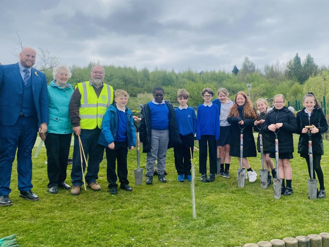 Pupils plant 100 trees to commemorate Rotary in Bolton - Rotarians and students plant their first tree